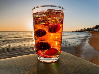 Italian soda drinks served in clear glasses with ocean views and fruit toppings in a photo grid