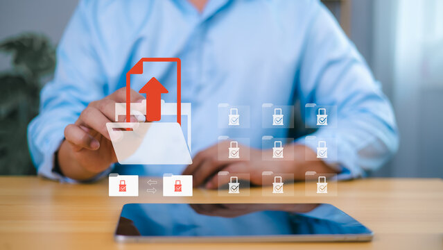 Secure data upload and cloud file sharing concept with businessman touching virtual folder icon - Powered by Adobe
