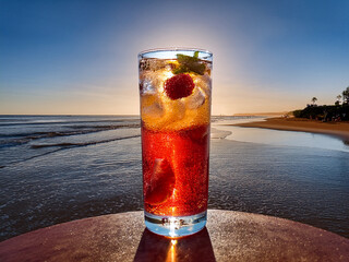 Italian soda drinks served in clear glasses with colorful layers and sunset beach lighting