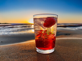 A beachside collage of Italian soda drinks with fruit garnishes and golden hour tones