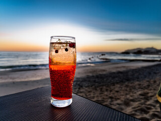 Italian soda drinks with vibrant colors and fruit toppings photographed at the ocean