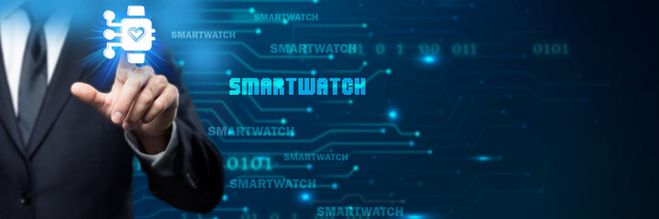 Businessman interacts with a glowing smartwatch icon in a digital, futuristic environment, symbolizing wearable technology, health monitoring, connectivity, and the future of personal wellness .