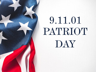 Patriot Day. We will never forget. American flag and lettering. Closeup, isolated background....