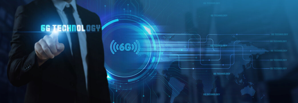 Businessman interacts with a futuristic "6G TECHNOLOGY" interface featuring a wireless signal icon, symbolizing next-generation mobile communication, global network connectivity, and the future .