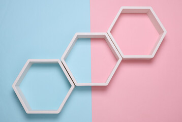 Hexagonal honeycomb shelves on pink blue background
