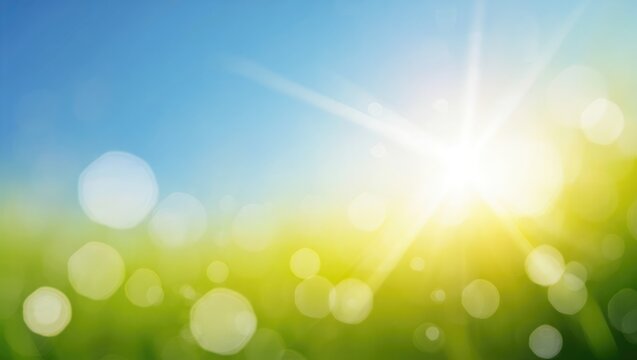 Bright sun shining over green field rays light