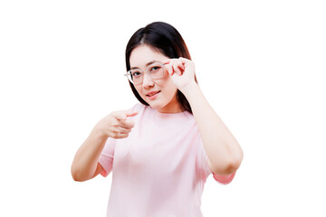 Asian young beautiful woman in a pink shirt adjusts her glasses while pointing forward with a...