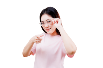 Asian young beautiful woman in a pink shirt adjusts her glasses while pointing forward with a confident expression.