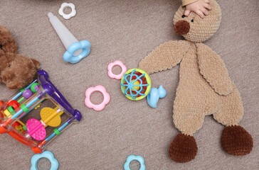 Lots of children's toys scattered on the floor
