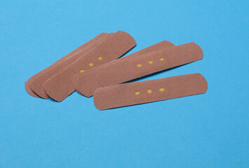 Medical Adhesive bandage plasters on blue background