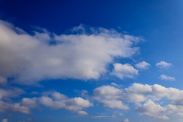 Blue Sky with White Clouds, clear sky with natural lightning, blue color, summer background, cloud landscape.