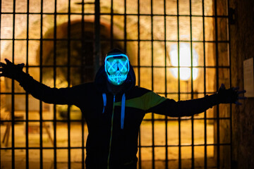 Purge mask, halloween with pumpkin. LED mask, creepy scary man. Corona, Funny, October, outside
