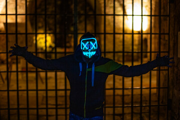 Purge mask, halloween with pumpkin. LED mask, creepy scary man. Corona, Funny, October, outside