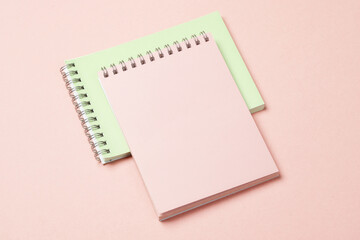 Two notebooks on pink pastel background. Minimalism. Creative layout