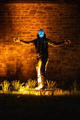 Purge mask, halloween with pumpkin. LED mask, creepy scary man. Corona, Funny, October, outside