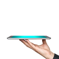 Hand holding tablet with turquoise screen on black background