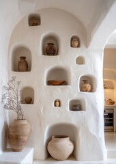 Whitewashed wall with terracotta pottery niches