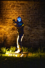 Purge mask, halloween with pumpkin. LED mask, creepy scary man. Corona, Funny, October, outside