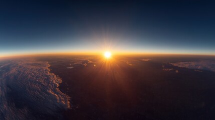 Panoramic view of Earth's sunrise, showing clouds and atmosphere.  A sunburst fills the horizon