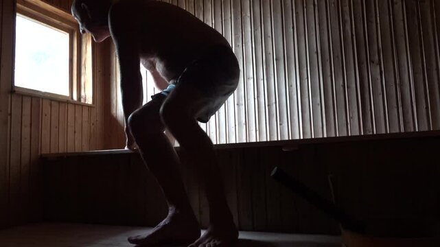 Stockholm, Sweden A man does exercises in a sauna. 