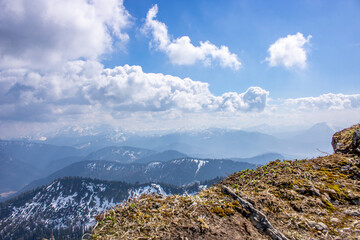Landscape photo of an uphill climb in spring. Typical landscape in sunshine in the German Alps.