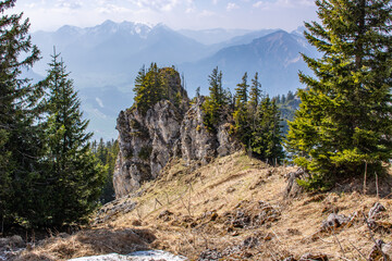 Landscape photo of an uphill climb in spring. Typical landscape in sunshine in the German Alps.