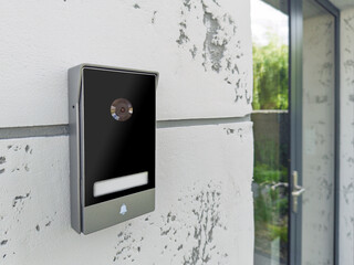 Smart doorbell with camera on modern wall