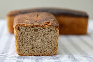 Rustic colonial rye bread. Well-lit image, clear selective focus on the details of the bread...