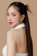 Fototapeta premium Beautiful portrait Asian Thai woman makeup of cosmetic on face smile attractive isolated on beige background.