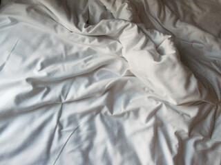 White blanket crumpled textile background messy. Fabric cotton background