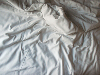 White blanket crumpled textile background messy. Fabric cotton background