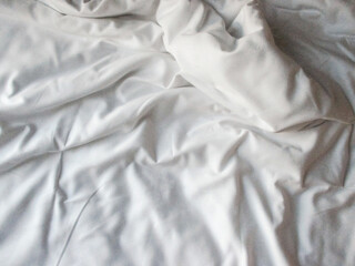 White blanket crumpled textile background messy. Fabric cotton background