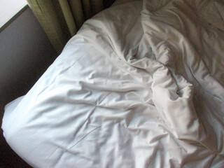 White blanket crumpled textile background messy. Fabric cotton background