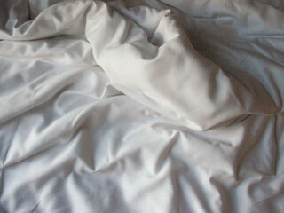 White blanket crumpled textile background messy. Fabric cotton background