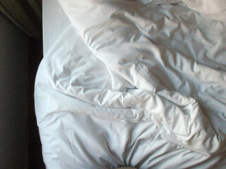 White blanket crumpled textile background messy. Fabric cotton background