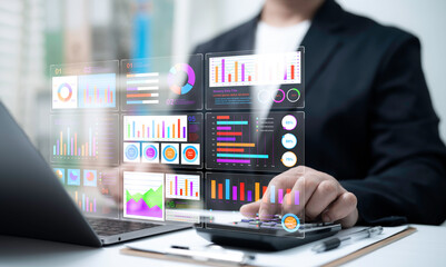 Businessman analyzing interactive analytics dashboard showing bar charts pie charts KPI graphs...