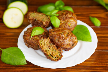 Zucchini muffins on a dark wooden table