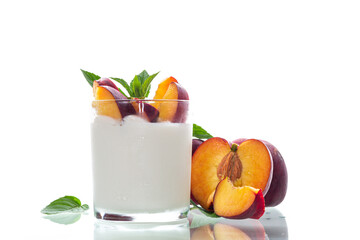 Homemade yogurt and bright ripe nectarines in studio shooting without background