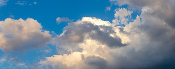 Picturesque blue sky with fluffy clouds illuminated by sunlight, summer day, atmosphere, nature,...