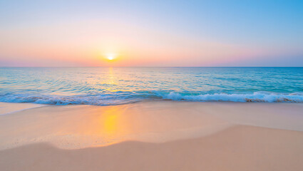 Fototapeta premium Golden sunset over the ocean, with soft clouds reflecting on the water and gentle waves lapping the sandy beach