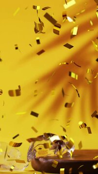 Animation of confetti falling and cocktail on yellow background