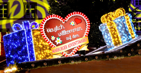 Festive Welcome Sign at Marburg Christmas Market with Illuminated Gift Boxes
