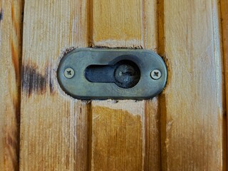 Keyhole, spider web.