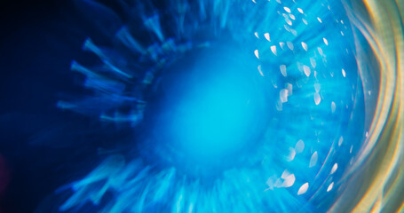 Shiny ray. Bokeh circle. Defocused blue yellow colorful radiant golden fluorescent lens flare...