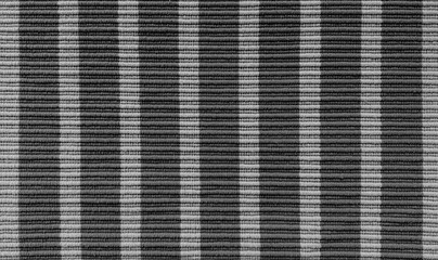 black and grey striped carpet texture background in close up view, perfect for flooring, rugs, and interior design concepts. pop art pattern for interior design.