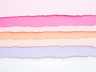 Fototapeta premium Layers of delicately torn pastel colored paper creating a textured and vibrant artistic background for creative projects and design inspiration