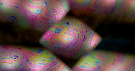 Soap defocused refraction. Kaleidoscope flow. Rainbow iridescent color paint oil diamond shape...