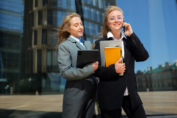 A group of professional women is gathering to network and collaborate in a vibrant, modern business...