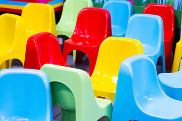 Fototapeta premium colored plastic chairs used in playrooms during children's parties