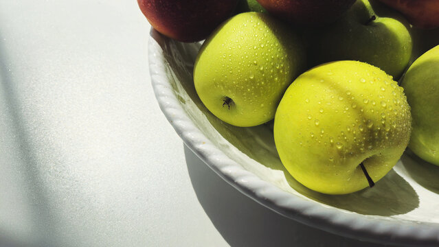 green apples in a bowl image with a place for text. organic food. healthy food diet